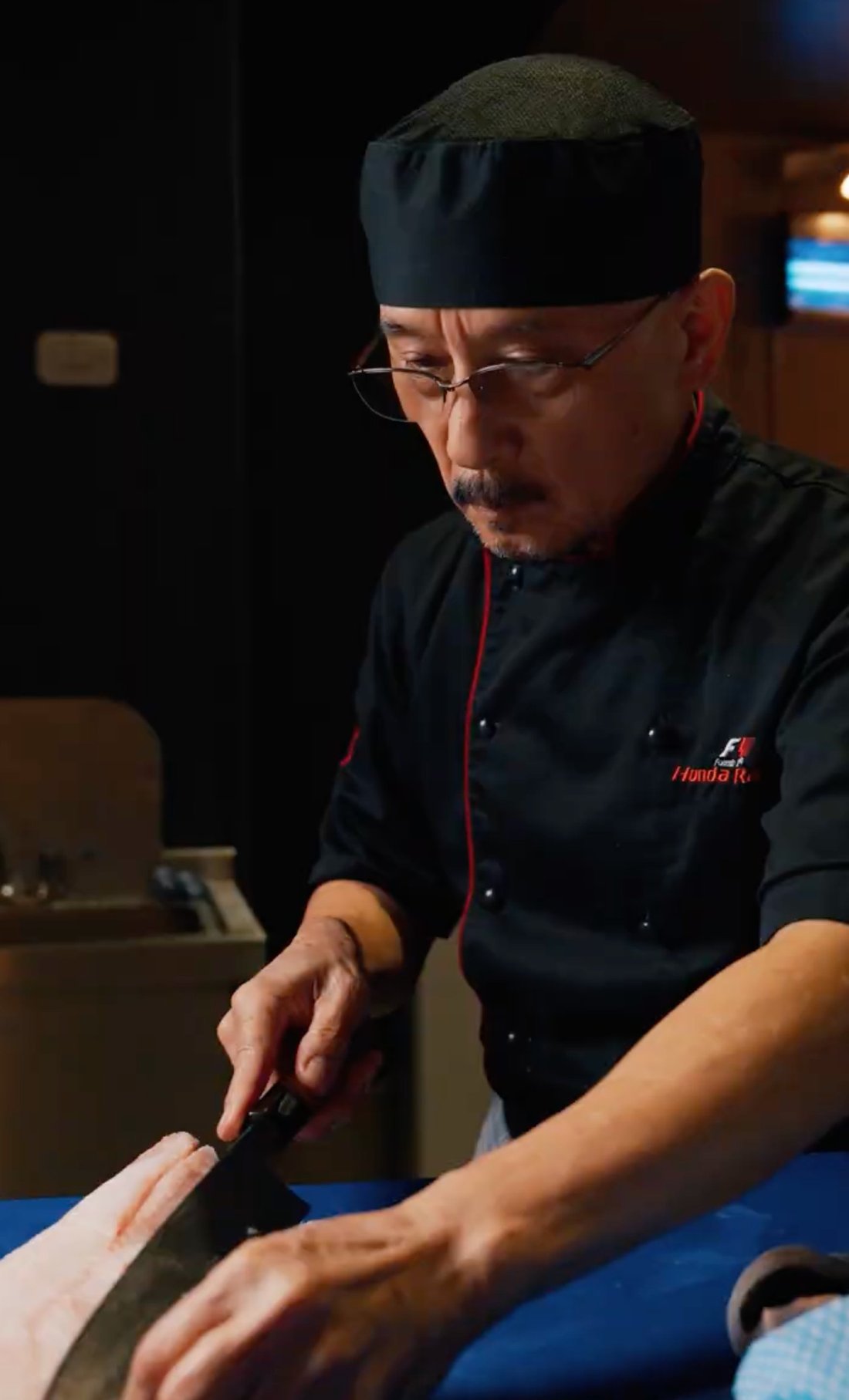 Shunji Irokawa, head sushi chef at Hotori, at the Edomae cutting block