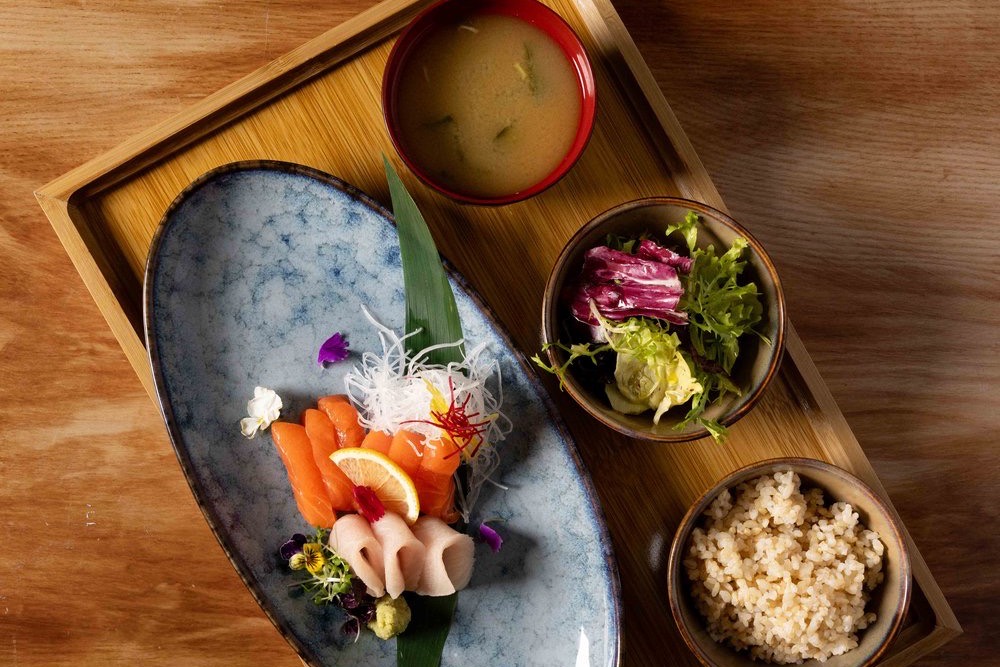 A sashimi set at Hotori: salmon, yellowtail and seasonal fish with miso soup, salad and rice